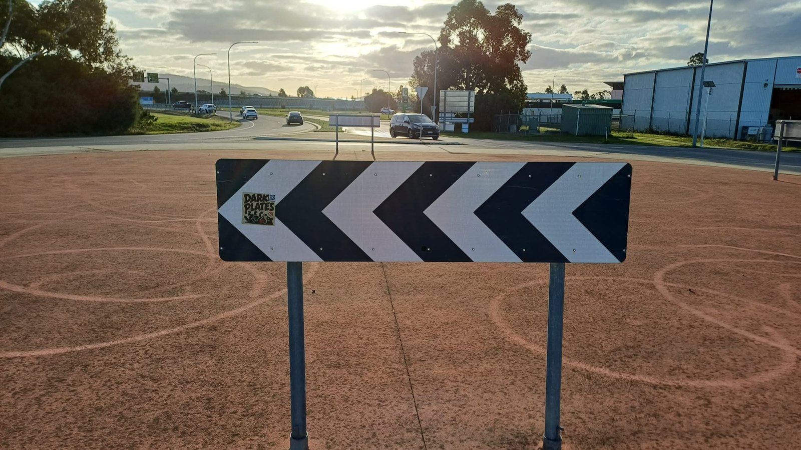 Dark Plates QR sticker on a road sign, northern outskirts of Hobart